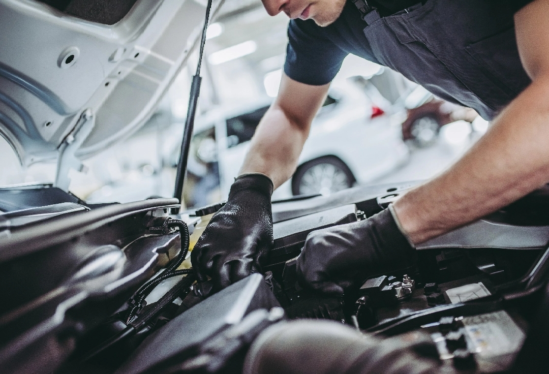 Technician working on car