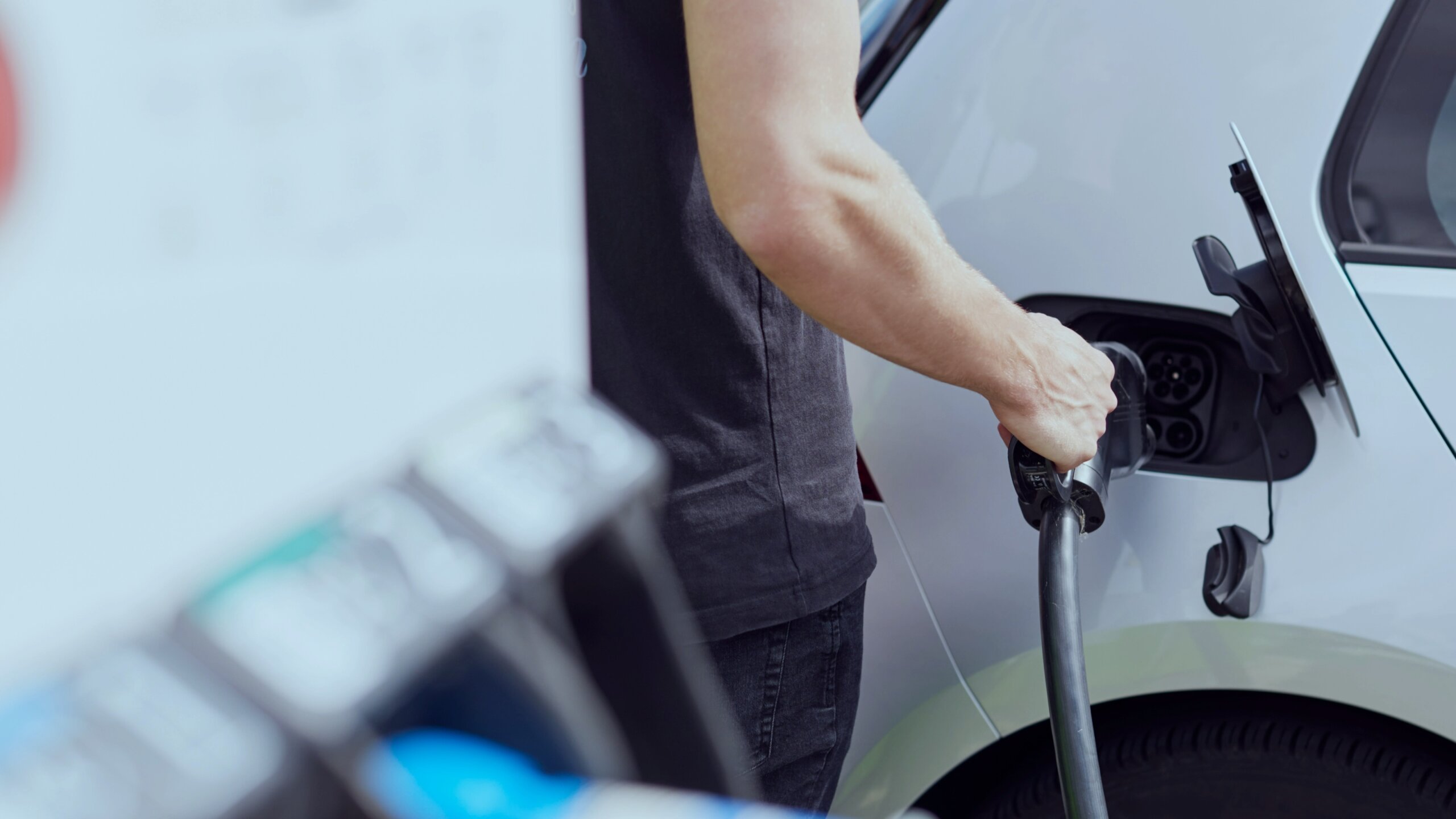 Person charging an EV